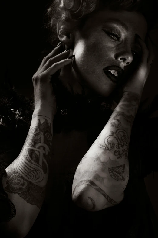 a black and white photo of a woman with tattoos, inspired by Taro Yamamoto, trending on pexels, art photography, african american woman, late night, androgynous vampire, set photo