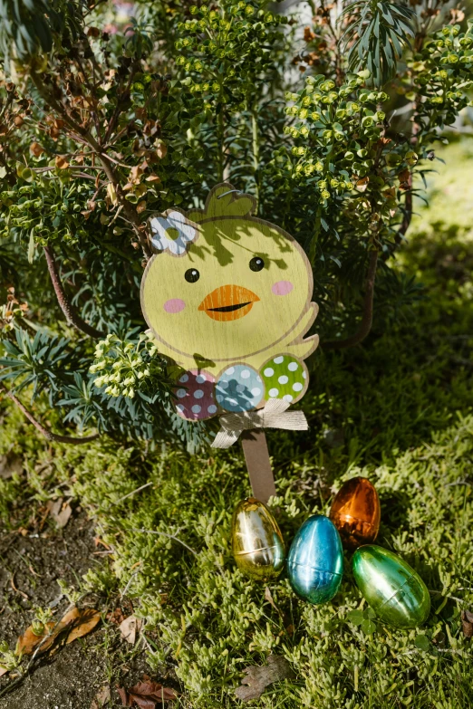 a bird that is sitting in the grass, inspired by Károly Patkó, happening, decorations, front shot, on a tree, easter