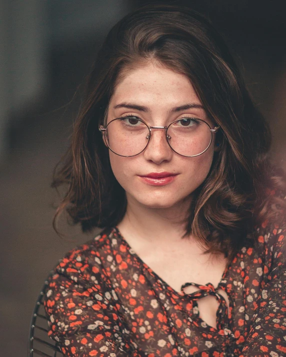 a woman with glasses posing for a picture, inspired by Elsa Bleda, trending on pexels, renaissance, brown haired, non-binary, lovingly looking at camera, charli bowater