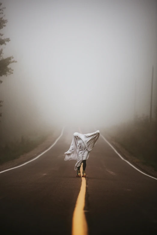 a person walking down a foggy road holding an umbrella, white cloth, ((mist)), ryan dyar, terrified