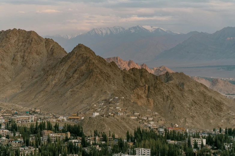 a view of a city with mountains in the background, by Carey Morris, pexels contest winner, hurufiyya, india, 4k detail post processing, panorama, alessio albi