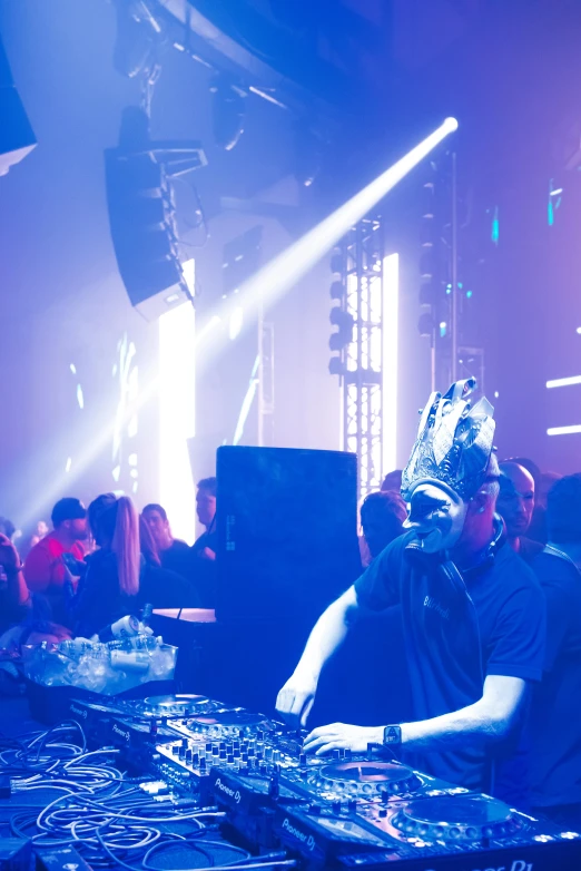 a dj mixing in front of a crowd of people, happening, wearing a bejeweled mask, liquid metal, harmony black room, profile image