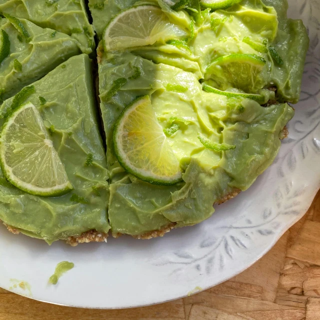 a white plate topped with a pie covered in avocado, by Alice Mason, lime green, thumbnail, raw, abcdefghijklmnopqrstuvwxyz