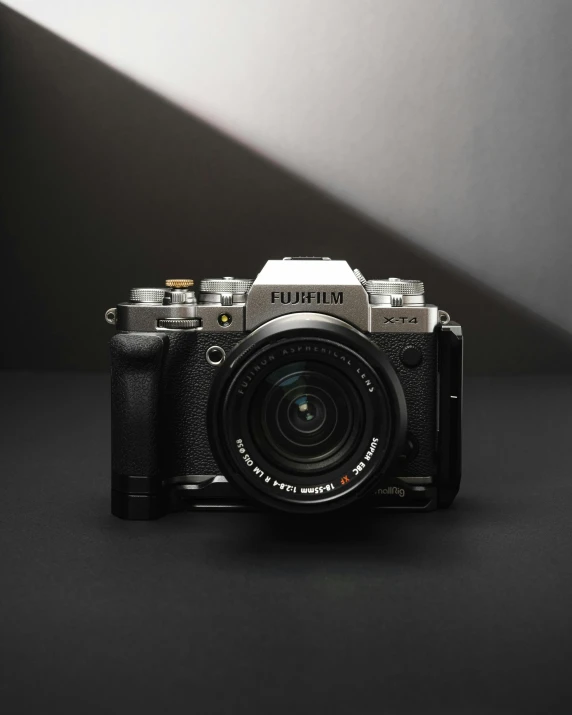 a black camera sitting on top of a table, a picture, fujifilm x - t 4, front lit, architectural photograph, facing front