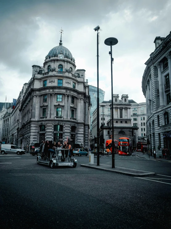 a street filled with lots of traffic next to tall buildings, a photo, by IAN SPRIGGS, pexels contest winner, art nouveau, on a great neoclassical square, carriage, grey, slide show