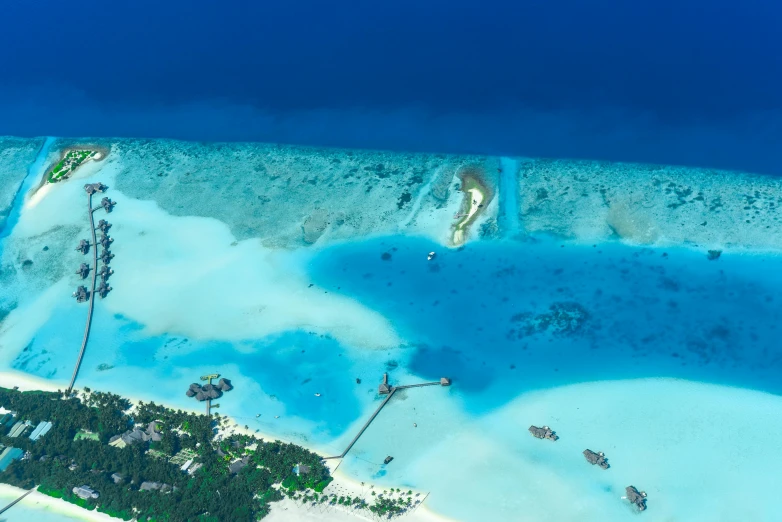 a small island in the middle of the ocean, by Julian Allen, pexels contest winner, hurufiyya, helicopter view, avatar image