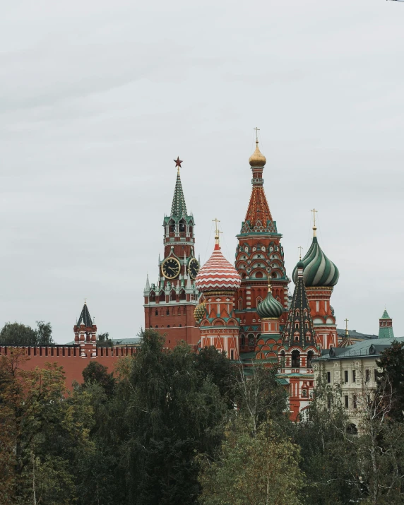 a plane flying over a city with a castle in the background, an album cover, inspired by Vasily Surikov, pexels contest winner, socialist realism, lgbtq, domes, red brown and grey color scheme, 000 — википедия