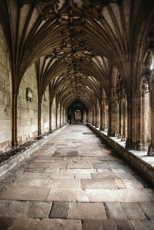 a very long hallway in a very old building, by Edward Clark, unsplash contest winner, renaissance, dry archways and spires, abbeys, exterior, 14th century