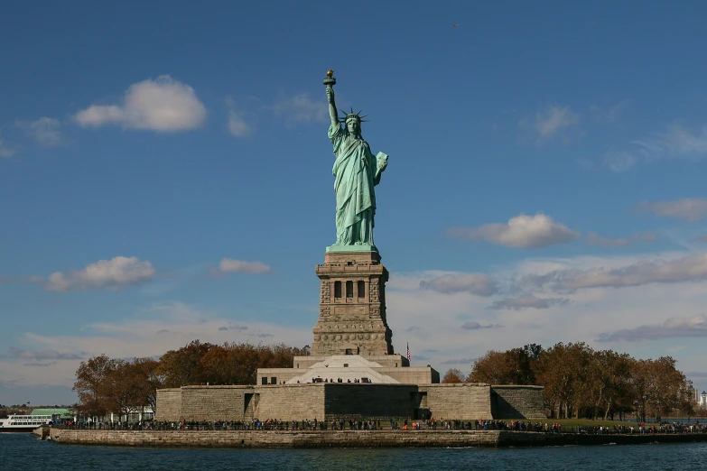a view of the statue of liberty from across the water, a statue, by Tom Wänerstrand, pexels contest winner, 15081959 21121991 01012000 4k, thumbnail, close full body shot, stacked image