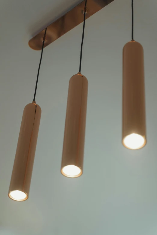 a group of three lights hanging from a ceiling, made of bamboo, fluorescent led, up close, nadir lighting