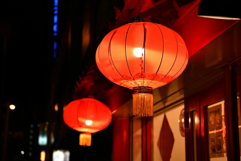 a couple of red lanterns hanging from the side of a building, dim red light, chinatown bar, 3delight, ready to eat