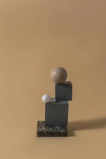 a wooden block with a ball on top of it, an abstract sculpture, inspired by Oskar Schlemmer, unsplash, taupe, porcelain holly herndon statue, two moons, ignant