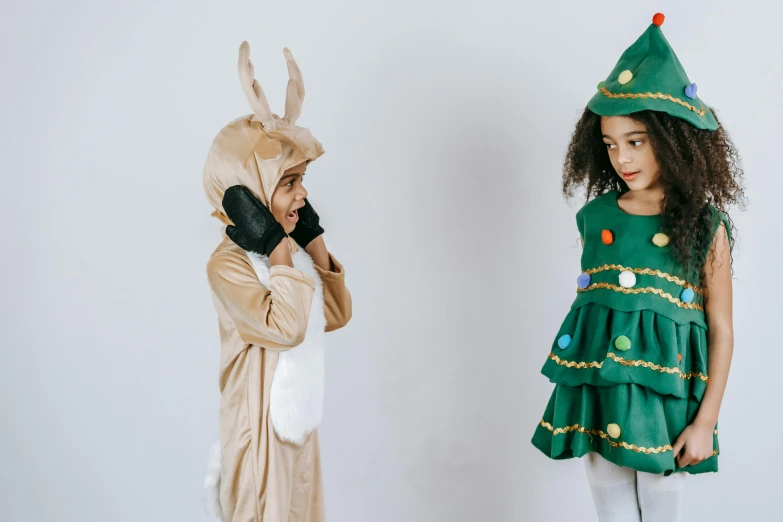 two children dressed in costumes standing next to each other, pexels contest winner, evergreen, animated, felt, various posed