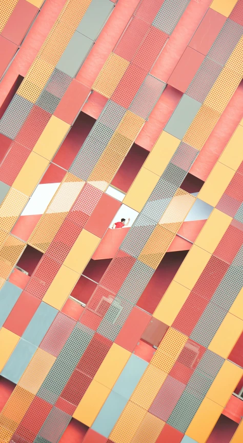 a plane flying in front of a multicolored building, unsplash contest winner, abstract illusionism, red grid, metallic reflective surfaces, high angle close up shot, square