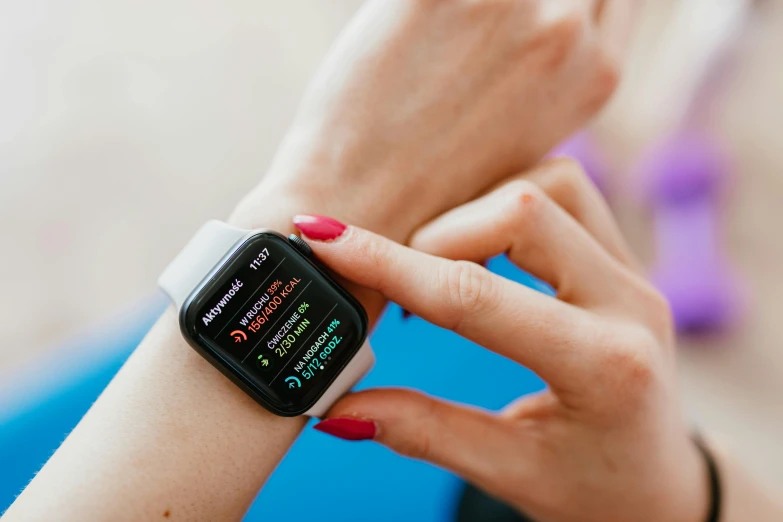 a close up of a person holding an apple watch, pexels, renaissance, square, test, a brightly coloured, sport