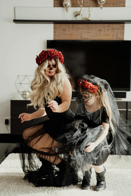 a couple of women sitting on top of a couch, pexels contest winner, kitsch movement, black roses in hair, daughter of death, fancy dress, funeral veil