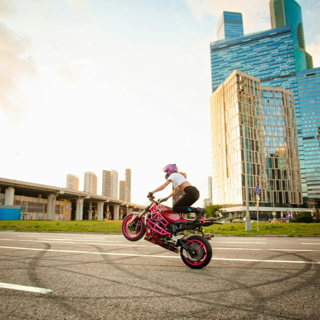 a person riding a pink motorcycle on a city street, a picture, by Jan Rustem, pexels contest winner, gta in moscow, bulky build, nychos, panoramic view of girl