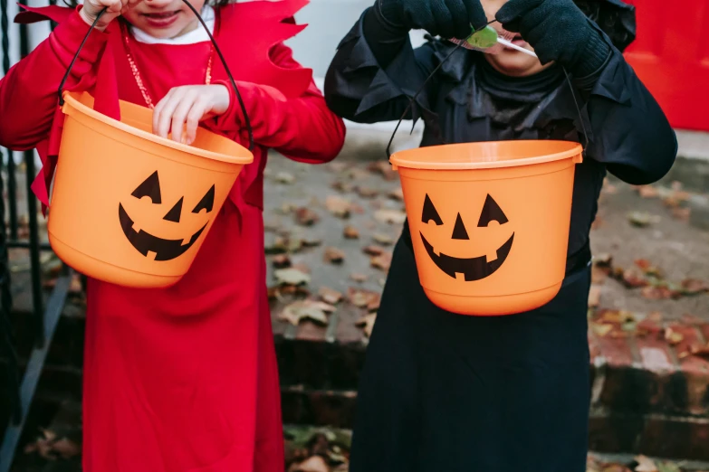 two little girls dressed up in halloween costumes, pexels, blank, cauldrons, orange jumpsuit, dark