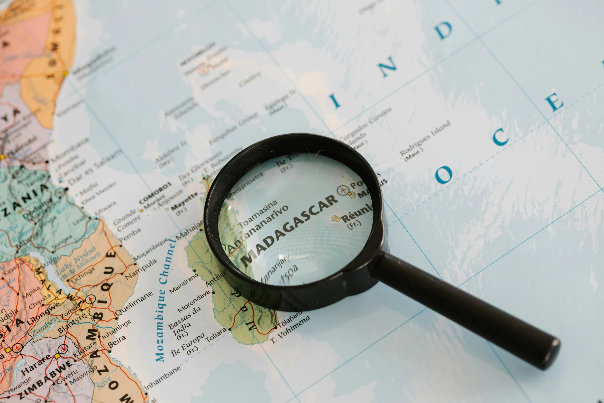 a magnifying glass sitting on top of a map, madagascar, detailed product image, instagram picture, medium close shot