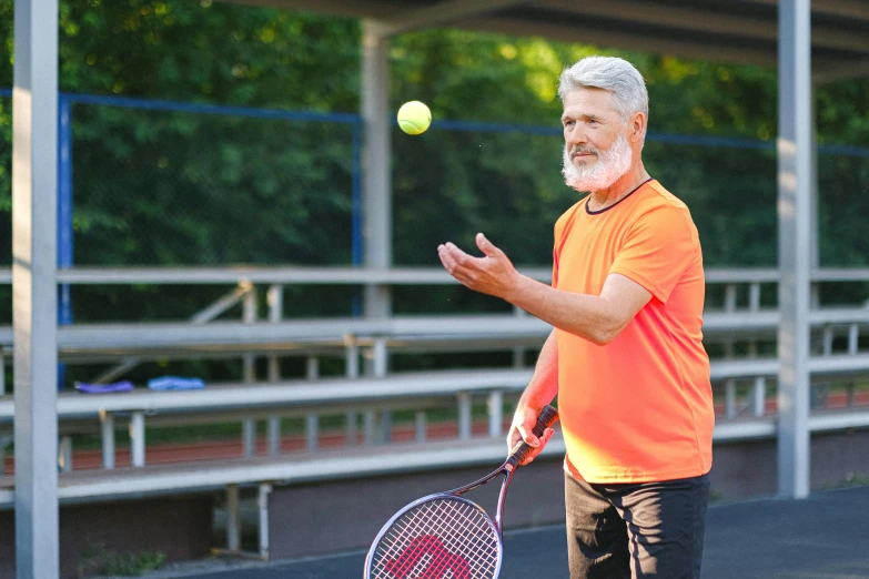 a man standing on top of a tennis court holding a racquet, bushy white beard, 15081959 21121991 01012000 4k, holding a ball, featured