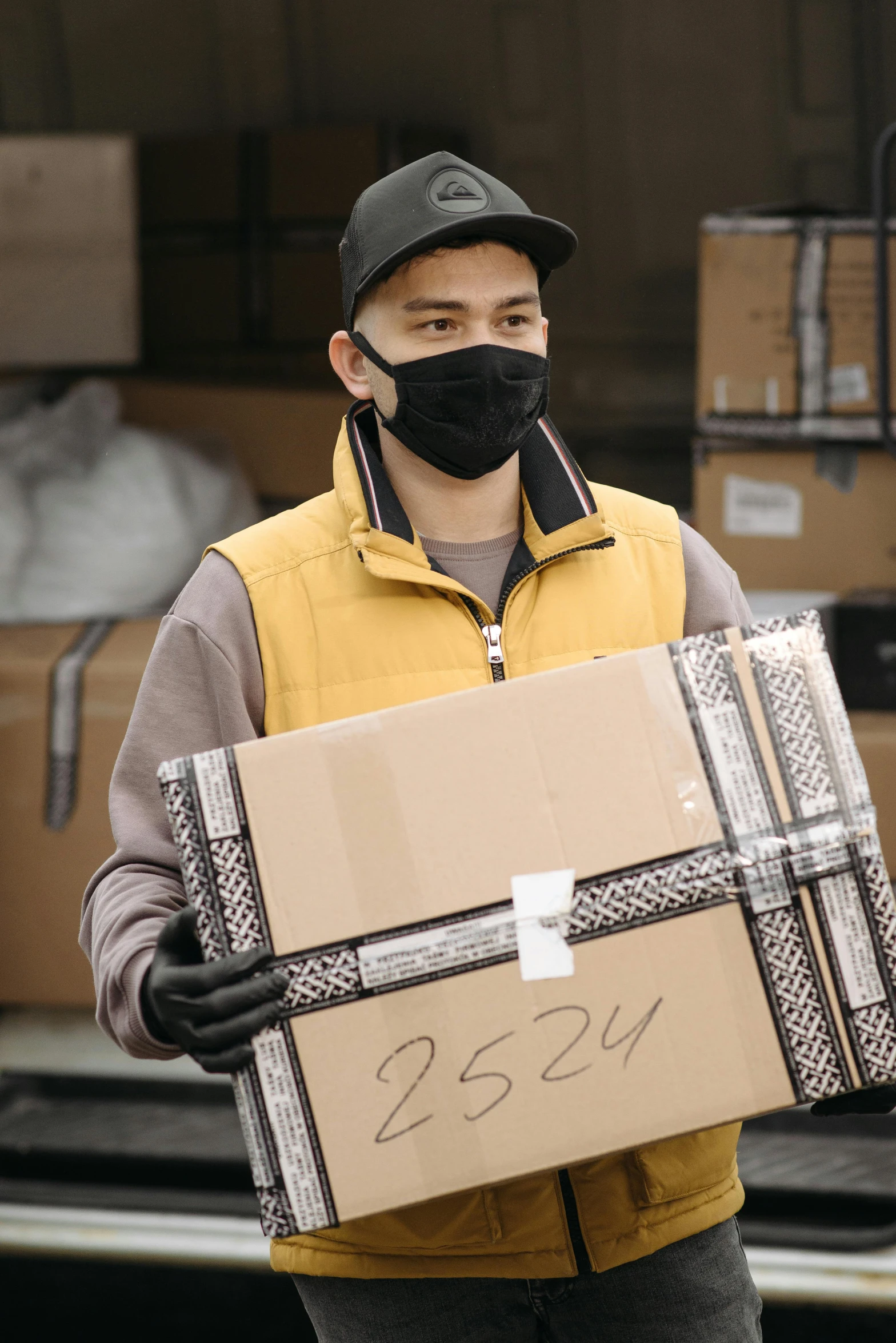 a man wearing a face mask holding a box, inventory item, thumbnail, large)}], gold