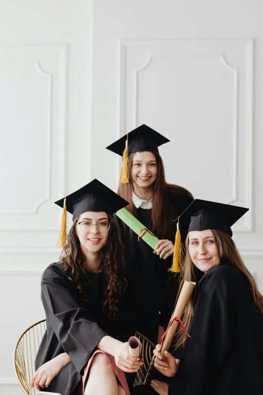 a group of women in graduation gowns posing for a picture, a picture, shutterstock, academic art, portrait n - 9, jovana rikalo, three women, promotional image