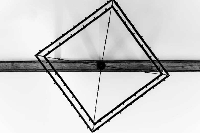 a black and white photo of a power line, by Kristian Zahrtmann, kinetic art, wooden ceiling, sharp geometrical squares, wrought iron, blacksmith product design