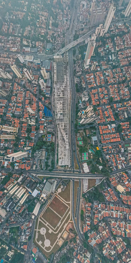 an aerial view of a city with lots of buildings, by Basuki Abdullah, pexels contest winner, photorealism, freeway, 8 k hyper detailed image, switch, hyperrealistic n- 4