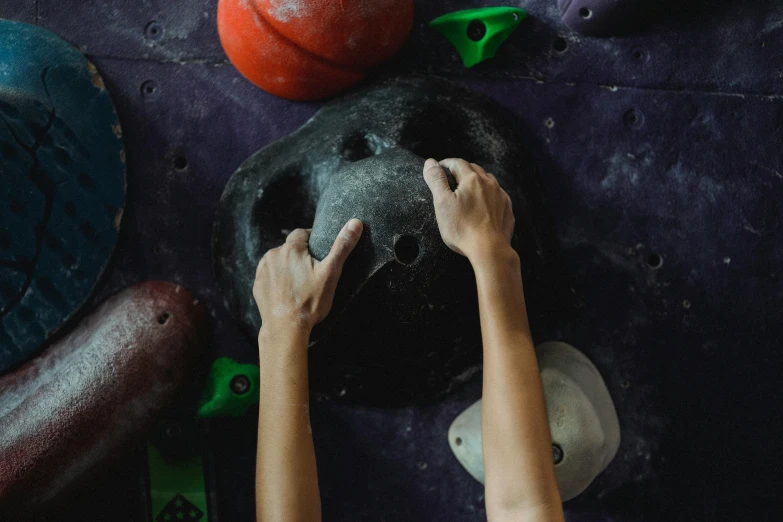 a close up of a person climbing on a wall, flatlay, boulders, hands on counter, inflateble shapes