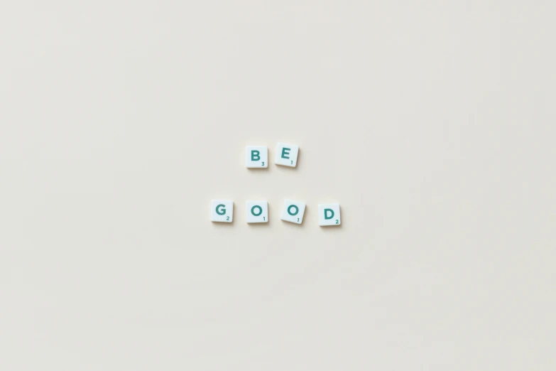 a white refrigerator freezer sitting on top of a white counter, by Emma Andijewska, unsplash, visual art, green letters, be occult, feeling good, cubes on table