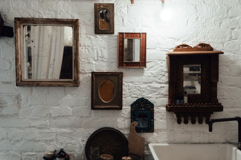 a bathroom with a sink and mirror on the wall, by Daniel Lieske, pexels contest winner, arts and crafts movement, hindu aesthetic, trinkets, white wall, brown