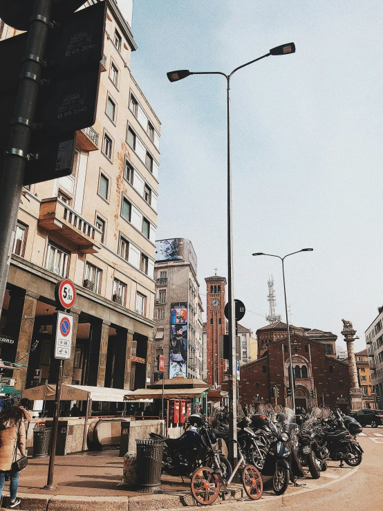 a group of motorcycles parked on the side of a road, a photo, trending on unsplash, hyperrealism, former gasometer in rome, big beautiful street lamps, 2 0 0 0's photo, ilustration