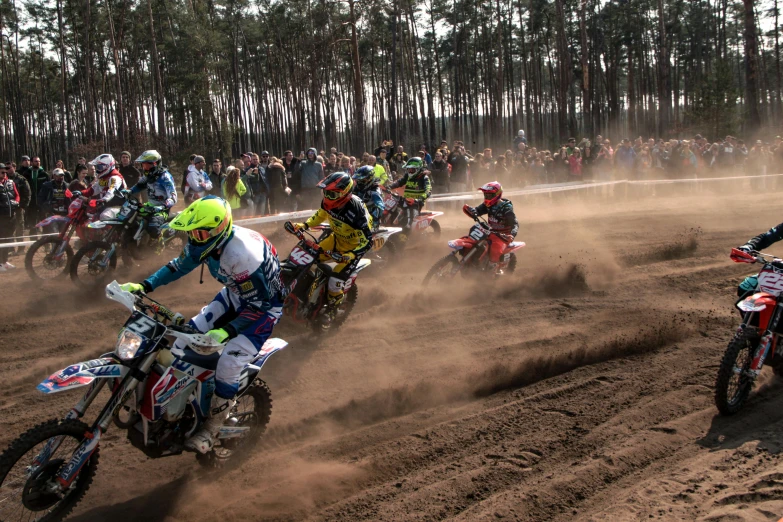 a group of people riding dirt bikes on a dirt track, by Adam Marczyński, pexels contest winner, photorealism, 2 5 6 x 2 5 6 pixels, massive vertical grand prix race, poland, sand