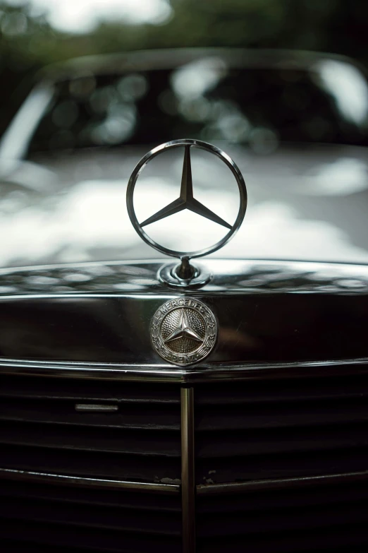 a mercedes emblem on the front of a car, by Gavin Hamilton, pexels contest winner, renaissance, diverse, mini model, 256435456k film, video