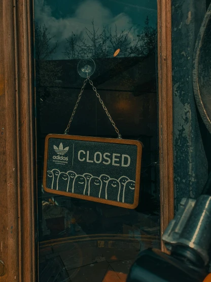 a close up of a sign on a door, by Andries Stock, trending on unsplash, closed ecosystem, teddy fresh, addidas, a steampunk store