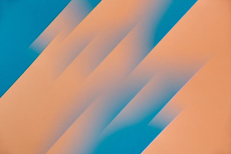 a close up of a cell phone with a blurry background, by Filip Hodas, unsplash, lyrical abstraction, orange to blue gradient, diagonal lines, abstract design. parallax. blue, abstract cloth simulation