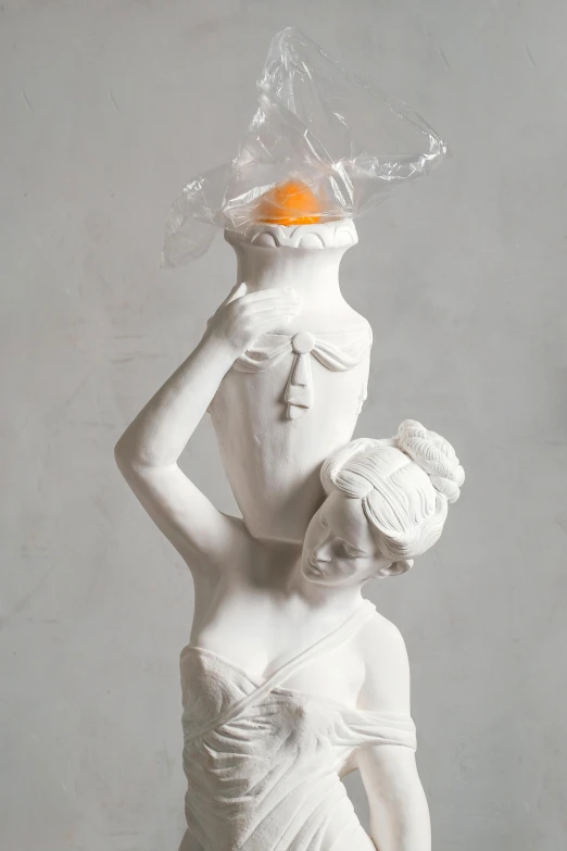 a statue of a woman with an orange on her head, a surrealist sculpture, inspired by Michelangelo Unterberger, dribble, new sculpture, white vase, demur, woman holding another woman, breakfast