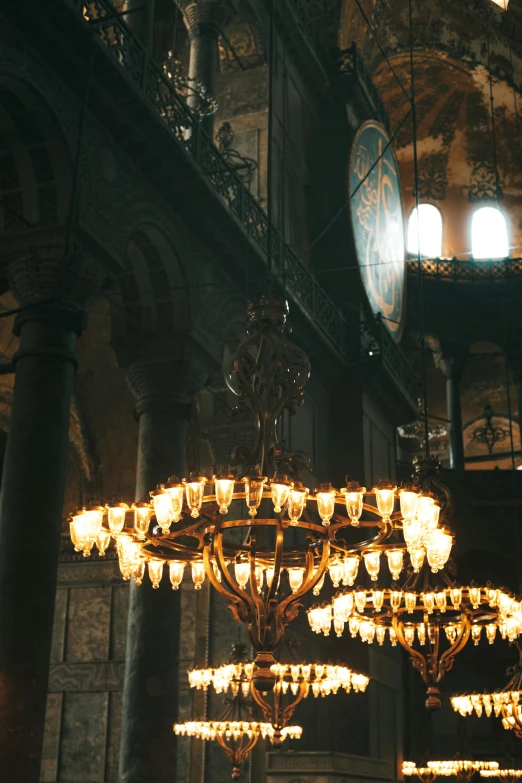 a large chandelier hanging from the ceiling of a building, mystical cathedral windows, istanbul, julia sarda, medium lighting