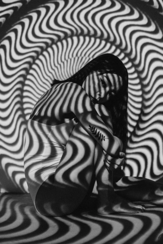 a black and white photo of a pair of shoes, inspired by Germaine Krull, op art, sunburst behind woman, swirly body painting, 3 6 0 projection, magnetic waves