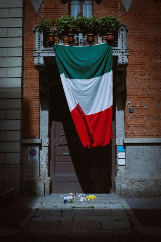 a large italian flag hanging from the side of a building, an album cover, pexels contest winner, littered, alessio albi, francisco de zurbaran, profile image