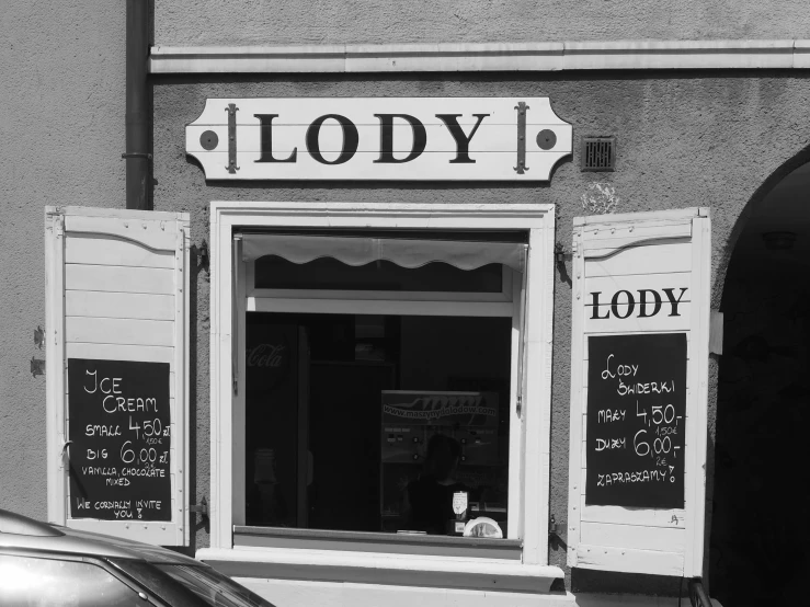 a black and white photo of a store front, by Károly Lotz, pixabay, art nouveau, mountains of ice cream, lord loss, style of lois royo, steady look