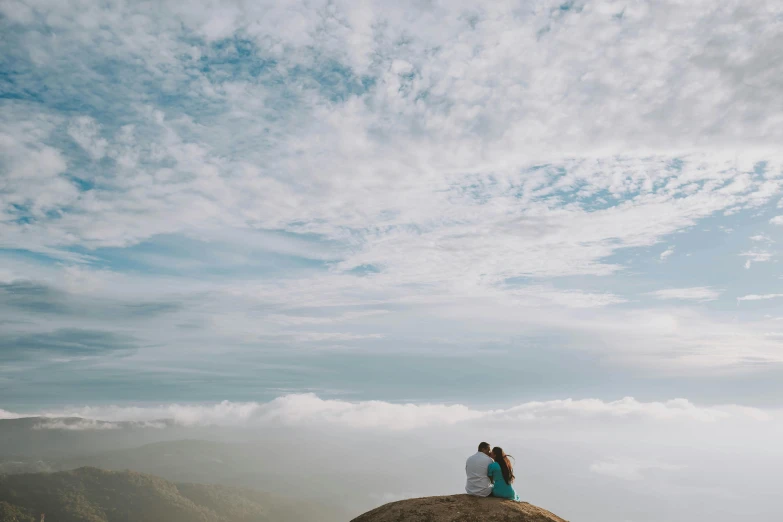 a couple sitting on top of a large rock, unsplash contest winner, romanticism, view above the clouds, profile image