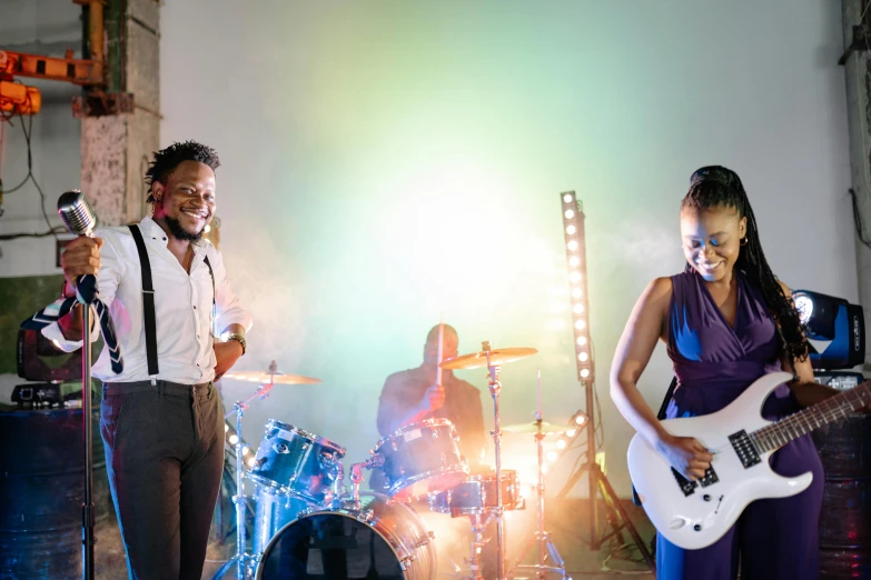 a couple of people that are on a stage, an album cover, by Ella Guru, pexels contest winner, happening, playing drums, maria borges, wedding, brightly-lit