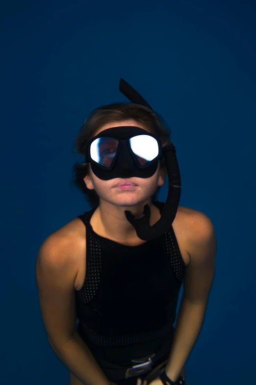 a woman with a pair of goggles on her face, by Robert Medley, happening, volumetric underwater lighting, oled visor over eyes, profile image, looking upwards