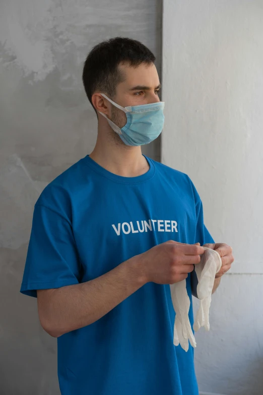 a man in a blue shirt wearing a face mask, offwhite, relief, thumbnail, bandages