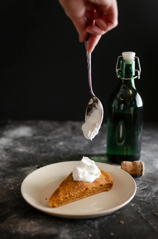 a white plate topped with a slice of pumpkin pie, inspired by Géza Dósa, trending on unsplash, holding flask in hand, whipped cream, pouring, on a gray background