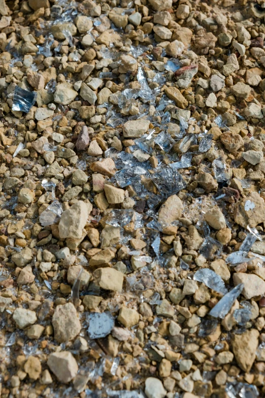 a red fire hydrant sitting on top of a pile of rocks, an album cover, inspired by Anselm Kiefer, unsplash, plasticien, close up of single sugar crystal, 4 k seamless mud texture, aluminum, blue