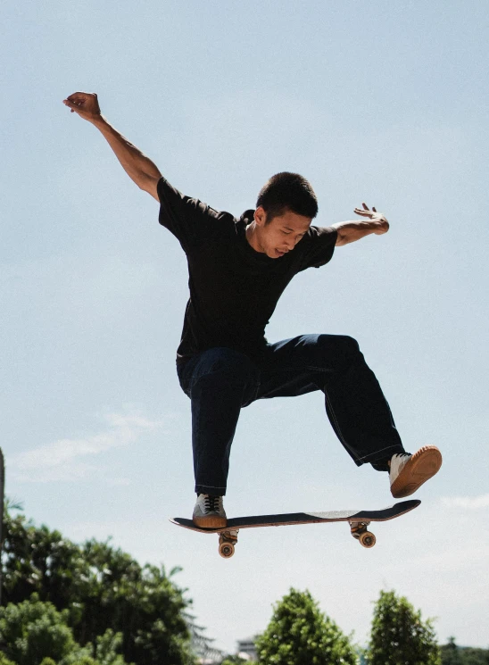 a man flying through the air while riding a skateboard, pexels contest winner, realism, wearing pants and a t-shirt, asian male, professional profile picture, reddit post