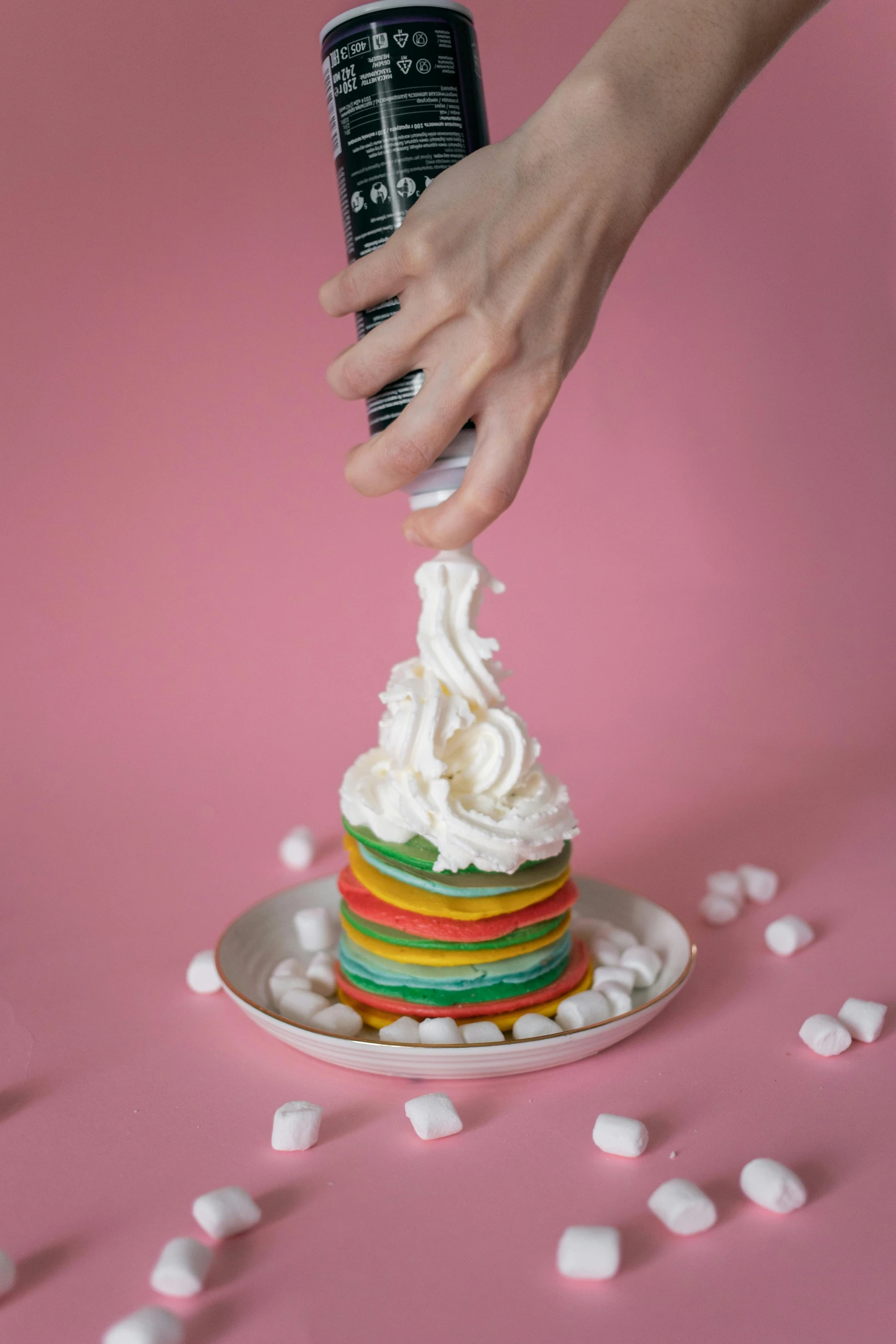 a person sprinkles marshmallows on top of a cake, inspired by Okuda Gensō, pancakes, full product shot, swirly, tall