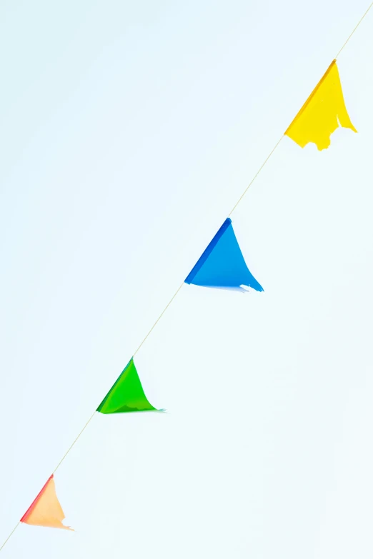 a person flying a kite in the sky, some yellow green and blue, green flags, detail, 1/60